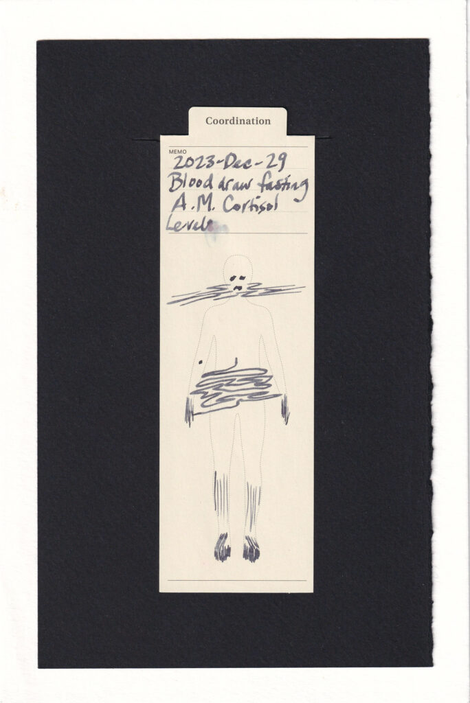 Bookmark printed with the outline of a human has been marked up with grey ink. Swirls like fog are around the face and lower abdomen. Other lines are in the hands, lower legs, and feet. A dot marks on the right arm where the blood was drawn. the face is two dot eyes and a small frown.